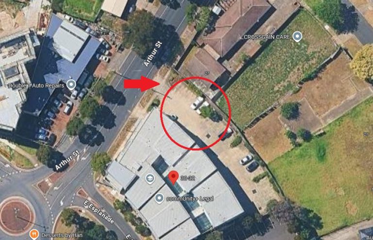 Satellite imagery of the Saint Albans site showing parking spots at the rear of the building. the community plus designated spots are the ones closest to the street (which is Arthur Street).