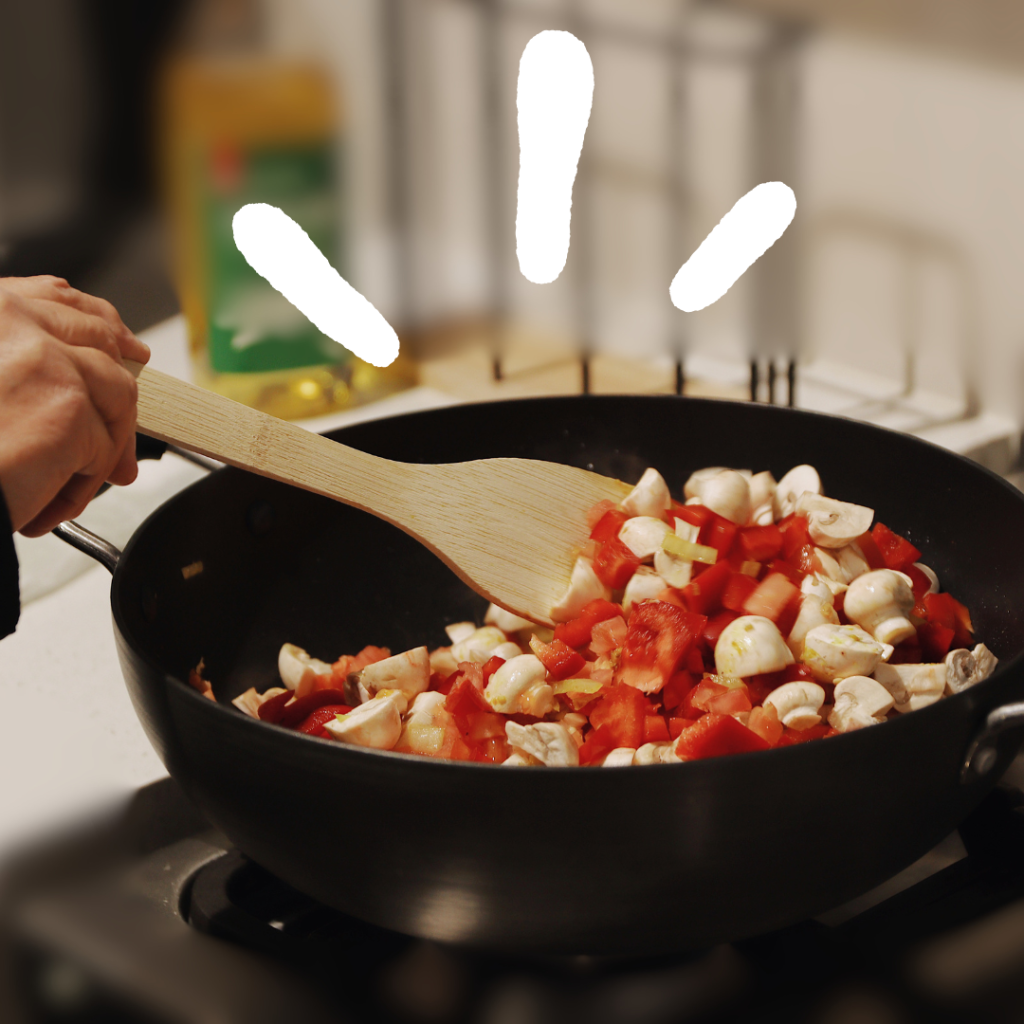 Turning over vegetables in a frying pan
